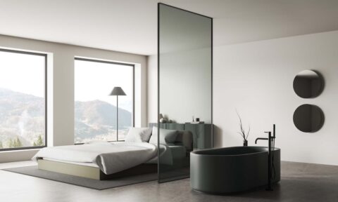 Modern flat interior with bathing and sleeping space, panoramic window